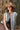 Woman wearing a Washed Denim Quilted Vest, brown dress  and decorated beige cowboy hat-FleaStyle