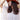 A woman with long, curly dark brown hair wearing a rust flat brim fedora style hat and an blush  ruffled blouse, outdoors against a yellow barn-Lenny_Wool_Short-Brim_Hat_-_Rust-FleaStyle