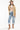 Woman wearing a brown cowboy hat, Oversized Suede Fringe Jacket - Camel and white cowboy poster graphic T-Shirt - White-FleaStyle