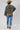 A woman wearing a western-style camo quilted jacket with white embroidered paisley patches, a white graphic tee,  paired with medium wash blue jeans with a relaxed wide-leg silhouette and a flattering high waist,  brown boots and cowboy hat, offers the perfect blend of comfort--Medium_Wash_Cuffed_Wide_Leg_Jeans-FleaStyle