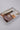 Hat styling kit with various vintage accessories including feathers, hatbands, a playing card, matchbook and vintage brooch-Fleastyle