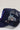 A navy blue embroidered butterfly trucker hat with a mesh back, featuring a blue and purple butterfly stick pins-Vintage_Double_Butterfly_Stick_Pin_-_Purple-FleaStyle