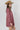 A woman wearing a feminine soft floral corduroy mini dress with tie and billowy sleeves a tan cowboy hat-Floral Corduroy Mini Dress-Floral Corduroy Mini Dress-FleaStyle