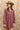 A woman wearing a feminine soft floral corduroy mini dress with tie and billowy sleeves a tan cowboy hat-Floral Corduroy Mini Dress-Floral Corduroy Mini Dress-FleaStyle
