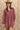 A woman wearing a feminine soft floral corduroy mini dress with tie and billowy sleeves a tan cowboy hat-Floral Corduroy Mini Dress-Floral Corduroy Mini Dress-FleaStyle