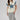 A woman modeling a cream short-sleeve top with a large blue denim star and a lace-trimmed sleeves, paired with neutral maxi skirt in a soft brown and ivory plaid, flattering bias-cut silhouette and an effortless drape-Plaid_High_Waist_Midi_Skirt_-_Khaki-FleaStyle