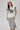 A woman modeling a cream short-sleeve top with a large blue denim star and a lace-trimmed sleeves, paired with neutral maxi skirt in a soft brown and ivory plaid, flattering bias-cut silhouette and an effortless drape-Plaid_High_Waist_Midi_Skirt_-_Khaki-FleaStyle