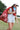 Woman holding a soccer ball with a blue bandana and white cap wearing a Striped-Front-Pocket-Drawstring-Shorts-DustyBlue-Fleastyle