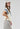 A woman modeling a cream short-sleeve top with a large blue denim star and a lace-trimmed sleeves, paired with neutral maxi skirt in a soft brown and ivory plaid, flattering bias-cut silhouette and an effortless drape-Plaid_High_Waist_Midi_Skirt_-_Khaki-FleaStyle