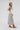 A woman modeling a cream short-sleeve top with a large blue denim star and a lace-trimmed sleeves, paired with neutral maxi skirt in a soft brown and ivory plaid, flattering bias-cut silhouette and an effortless drape-Plaid_High_Waist_Midi_Skirt_-_Khaki-FleaStyle