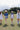 Four soccer players on a grassy soccer field wearing hats and boots and a Striped_Texas_Graphic_T-Shirt_-_Dusty_Blue-Fleastyle.