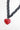 A necklace features chunky black sculptural links finished with an oversized red heart pendant -Vintage_Resin_Heart_Link_Necklace-FleaStyle