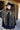 A woman wearing a black cowboy hat, an ornate long beaded black and gold fringe caplet over a black lace tunic standing in a rustic barn-Beaded_Fringe_Capelet_-_Gold-FleaStyle