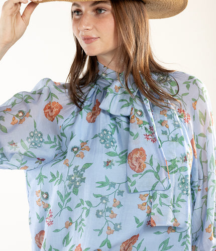 Woman wearing a Floral Long Sleeve Blouse with Neck Tie and tan straw hat-FleaStyle