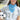 Woman holding a soccer ball with a blue bandana and white cap wearing a Striped_Texas_Graphic_T-Shirt_-_Dusty_Blue-Fleastyle