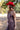 A woman red curl brim cowboy hat and a sheer leopard-print dress with a high ruffled collar and cowboy boots in a field-Rider_Wool_Cowboy_Hat_-_Red-FleaStyle