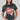 A woman wearing a cotton graphic tee featuring a lived-in charcoal wash, relaxed fit and bold 'She's From Texas Can Tell' graphic design, paired with a beige cowboy hat and jeans-She_s_From_Texas_Graphic_T-Shirt_-_Red-FleaStyle