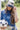 Woman wearing a Futbol-Ya_ll-Canvas-Trucker-Hat- cap with text, holding a soccer ball outdoors-Fleastyle.