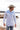 Man wearing a light blue patterned shirt and Jenner Cowboy Cashmere Wool Hat - Stone by a the shoreline-FleaStyle