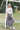 Soccer player standing in front of a soccer goal wearing a 'Texas Y'all shirt , striped skirt Concho-Disc-Belt-Silver-and-Black-holding a soccer ball-Fleastyle.