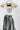 Woman wearing a 'Texas Y'all' t-shirt, striped skirt, and cowboy boots and a Concho Disc Belt - Silver and Black-Fleastyle