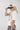 Woman wearing a Futbol-Ya_ll-Canvas-Trucker-Hat- cap with text, holding a soccer ball outdoors-Fleastyle.