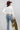 A woman wearing a classic long-sleeve tee features a flattering, fitted silhouette with an elegant boat neckline worn alone or styled as an effortless layering piece--Boat_Neck_Long_Sleeve_Top_-_Ivory-FleaStyle