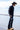Man wearing a Flea Style Rider Charcoal Wool Western Hat and dark jacket and cowboy boots-FleaStyle