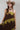 A woman  wearing a chocolate  brown maxi dress with olive green lace trim, styled with a stone/beige cowboy hat and brown boots -Lace_Trim_Maxi_Dress_-_Brown_Chartreuse-FleaStyle