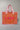 An orange quilted fabric tote bag with a paisley bandana border, pink fringe trim, and the word 'LOVE' embroidered in pink on the front for a casual day out-Love_Bandana_Quilted_Tote_Bag_-_Orange-FleaStyle