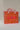 An orange quilted fabric tote bag with a paisley bandana border, pink fringe trim, and the word 'LOVE' embroidered in pink on the front for a casual day out-Love_Bandana_Quilted_Tote_Bag_-_Orange-FleaStyle