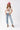A woman wearing an ivory "Dolly" graphic t-shirt, a pink cowboy hat and a flattering high-rise relaxed wide-leg jean with oversided cuffs for an effortlessly cool look-Super High Rise Cuffed Baggy Straight Jeans-FleaStyle