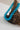 Woman wearing a Chunky Beaded Choker Necklace - Turquoise on a piece of driftwood-Fleastyle
