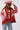 A woman wearing a red paisley jacket featuring an easy, relaxed silhouette with quilted detailing, contrasting stitching and beautiful lace appliqués that give it a cool, collected-over-time feel-Quilted_Jacket_with_Paisley_Patches_-_Red-FleaStyle