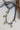 Bandana-Charm-Necklace-Navy_Gold-Fleastyleon a white surface-Fleastyle