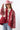 A woman wearing a red paisley jacket featuring an easy, relaxed silhouette with quilted detailing, contrasting stitching and beautiful lace appliqués that give it a cool, collected-over-time feel-Quilted_Jacket_with_Paisley_Patches_-_Red-FleaStyle