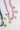Necklace with pink floral pattern and gold charms on a white background-Fleastyle