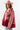 A woman wearing a red paisley jacket featuring an easy, relaxed silhouette with quilted detailing, contrasting stitching and beautiful lace appliqués that give it a cool, collected-over-time feel-Quilted_Jacket_with_Paisley_Patches_-_Red-FleaStyle
