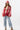 A woman wearing an ivory "Dolly" graphic t-shirt, a pink cowboy hat and a flattering high-rise relaxed wide-leg jean with oversided cuffs for an effortlessly cool look-Super High Rise Cuffed Baggy Straight Jeans-FleaStyle