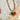 Enamel-Heart-Beaded-Necklace-Tortoiseshell-Fleastyle with a heart-shaped amber pendant on a textured background-Fleastyle