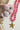Beaded Necklace with Star Pendant - Hot Pink on a white surface with seashells and rope-Fleastyle