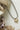 Mixed Metal Heart Ball Chain Choker Necklace with a gold heart charm on a white surface with natural elements-Fleastyle