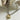 Mixed Metal Heart Ball Chain Choker Necklace with a gold heart charm on a white surface with natural elements-Fleastyle