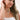 Woman wearing a white top and Sun Charm Scarf Necklace against a plain background- Fleastyle