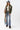 A woman wearing a classic long-sleeve tee features a flattering, fitted silhouette with an elegant boat neckline worn alone or styled as an effortless layering piece--Boat_Neck_Long_Sleeve_Top_-_Ivory-FleaStyle