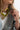Close-up of a person wearing a Love Statement Charm Necklace-Fleastyle