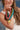 Woman wearing colorful beaded necklaces with a Beaded Necklace with Star Pendant - Hot Pink on denim backdrop-Fleastyle.
