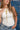 Woman wearing a white tank top and blue jeans with a Medallion Pendant Curb Chain Necklace - Gold standing against a denim background-Fleastyle