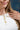 Woman wearing  a Cowgirl Charm Lariat Necklace with a heart pendant , horseshoe, cross and diamond-Fleastyle