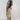 A woman wearing a brown straw cowboy hat, a dark gray California graphic t-shirt, and ruched wide leg pant featuring a festive star print, an easy pull-on fit and adjustable ankle ties-Ruched_Wide_Leg_Star_Print_Pants-FleaStyle